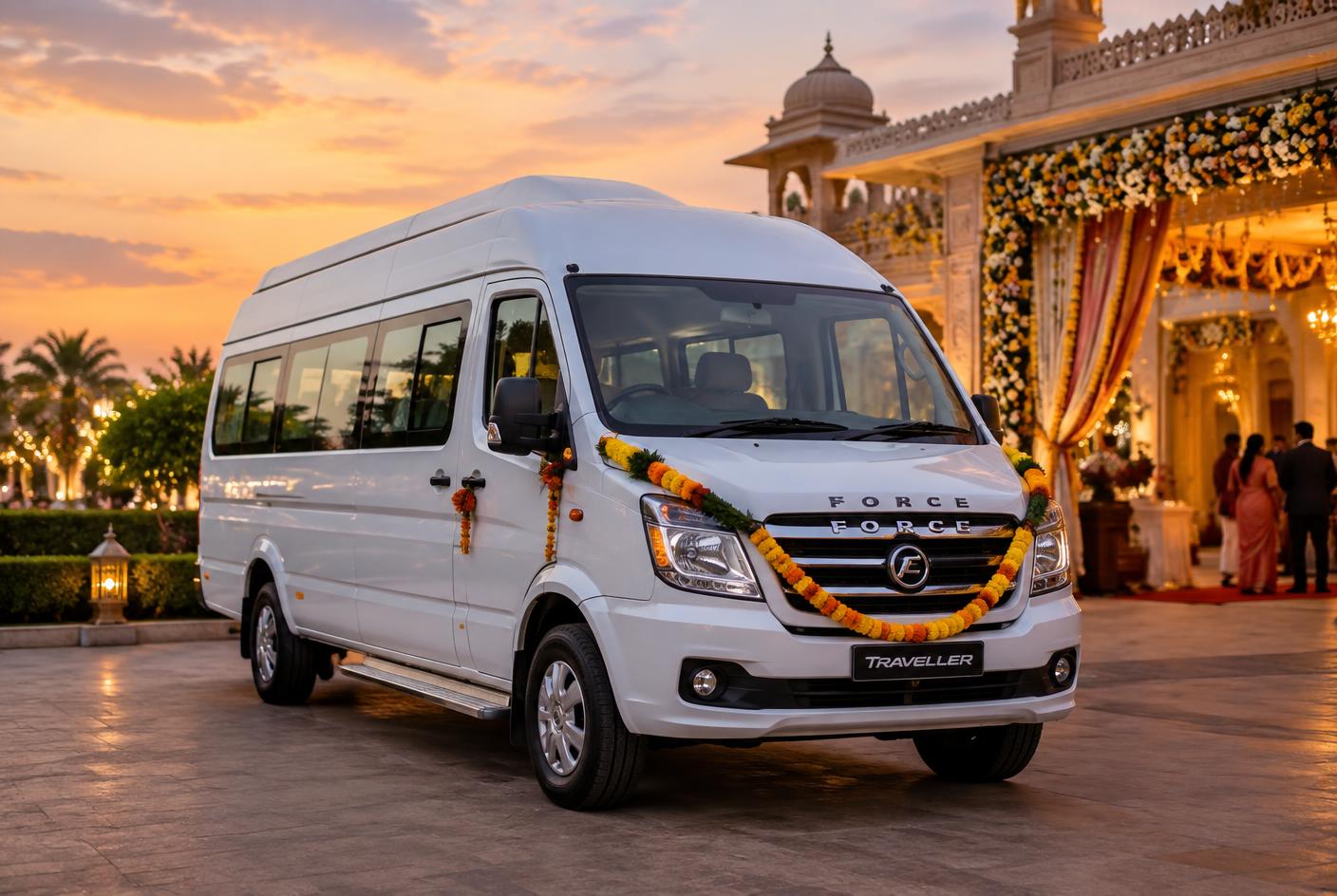 Force Traveller van decorated with marigold flowers outside an Indian wedding venue